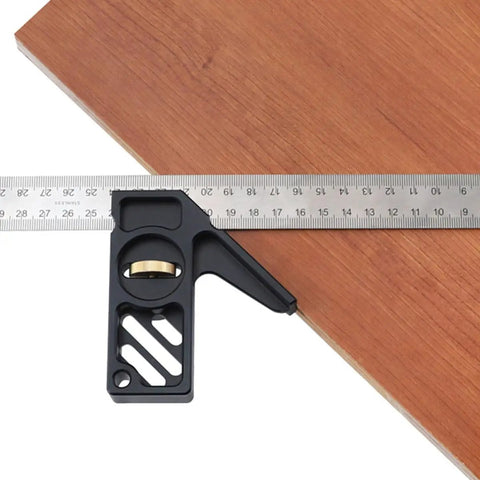 Professional Grade Carpentry Combination Square Layout Ruler With Dead On 45 And 90 Degree Marking on wood with measuring tape.
