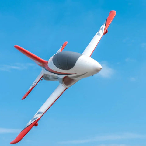 50mm EDF Jet RC Plane For Adults in flight against blue sky, red and white design, showcasing 4 channel remote control airplane features.
