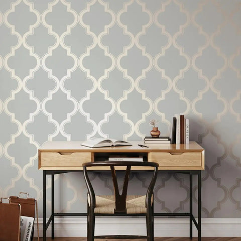 Dope Metallic Bronze Gray Marrakesh Peel And Stick Wallpaper Removable Self Adhesive Matte Trellis Design Pack Of 2 In 20.5 In X 16.5 Ft Made In The USA No Glue Needed No Residue on a wall behind a desk with chair.