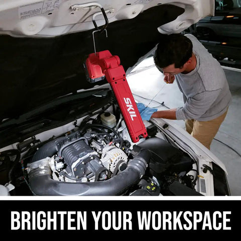 Heavy Duty Led Work Light 12 Volt Compact Task Lamp rock solid job site illumination used by mechanic under vehicle hood.