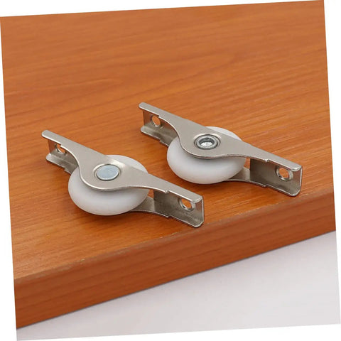Smooth Gliding Sliding Door Rollers 4 Pack Heavy Duty Barn Door Wheels on wood surface, featuring stainless steel and white wheels.