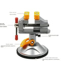 Super Durable Cast Iron Small Bench Vise With Suction Cup Flat Jaws And Precision Clamping Power For Hardwood Carving DIY Projects At Home Workshop Or Garage Table Use with adjustable jaws and suction base.