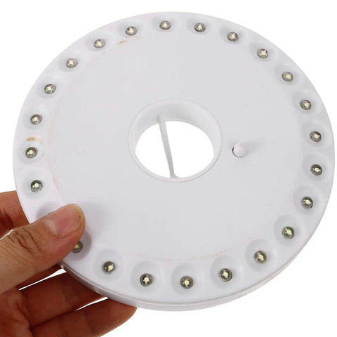 Top view of Portable Round Camping Lantern With LED Lights For Outdoor Use Waterproof Tent Light, showing LED bulbs and design
