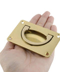 Hand holding Two Pack Recessed Gold Pull Handles Hidden Flush Drawer Pulls For Cabinets And Closet Doors Durable Copper Construction Easy Install With Screws 80mm x 48mm Hardware Kit