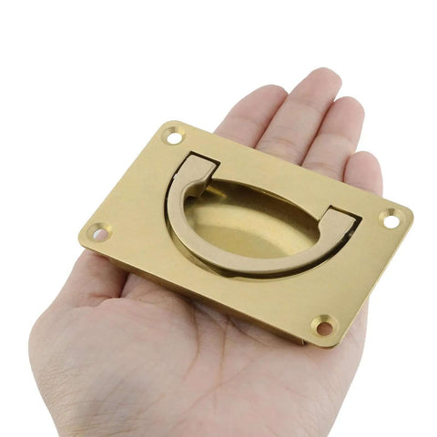 Hand holding Two Pack Recessed Gold Pull Handles Hidden Flush Drawer Pulls For Cabinets And Closet Doors Durable Copper Construction Easy Install With Screws 80mm x 48mm Hardware Kit