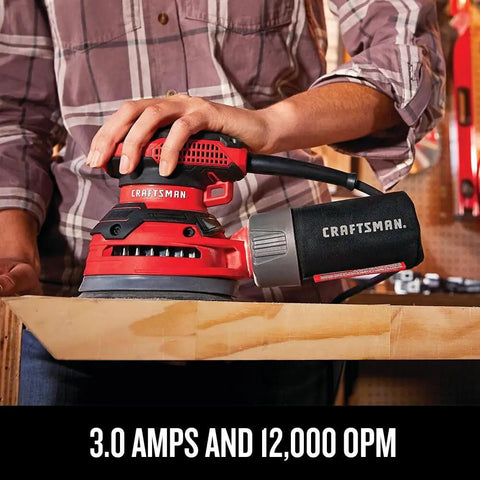 Person using Beast 5 Inch Orbital Sander With 12000 OPM, 3 Amp Corded Hand Sander, onboard dust bag, and vacuum hose connected.