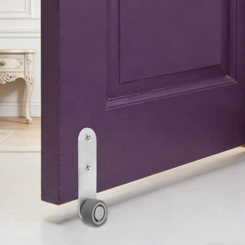 Premium 6 Pack Silver Sliding Door Roller Casters With Reinforced Steel Core And TPE Wheels Includes Anti Sagging Floor Guide For Barn Doors That Glide Damn Smooth Every Time, showing a caster guide installed on a purple door.