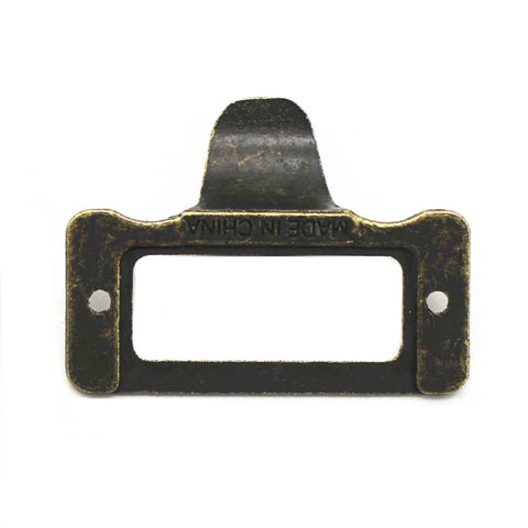 Front view of a single antique iron cup pull handle, bronze tone finish with subtle label frame card holder style.