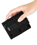Hand holding Durable Camera Battery Pouch Case For 2 Batteries With Zipped Card Pocket, black polyester, compact size