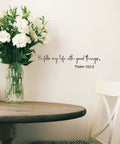 Bible Verse Wall Decals Set With Inspirational Quotes Peel And Stick Religious Scripture Stickers For Bedroom Living Room Office And Bathroom Decor To Lift Your Vibe And Feed Your Faith on wall beside flowers on table.