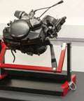 Beefy No Fuss Motorcycle Engine Stand For 2 And 4 Stroke Single Cylinder Engines Dirt Bike ATV MX Maintenance Stand shown with engine.