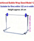 Hella Sturdy Tabletop Bubble Wrap Dispenser With Adjustable Roll Holder For Thick Foam Packaging Makes Shipping A Total Snap Fits Wide Rolls Up To 48 Inches No Sweat Galvanized Steel Rack with blue rollers and reinforced design.