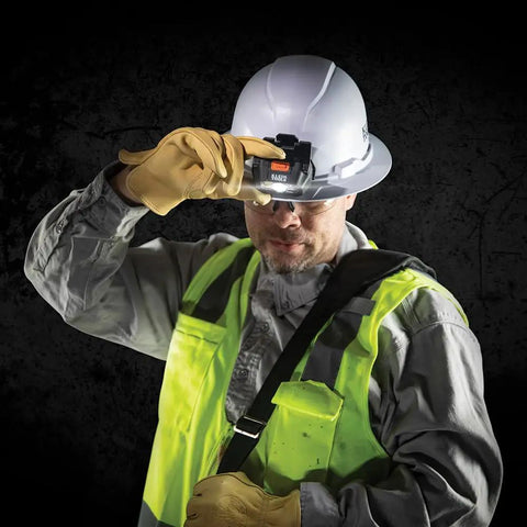 Worker wearing hard hat with Intrinsically Safe LED IP67 Headlamp for Hazardous Areas Attaches to Hard Hats and Safety Helmets