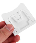 Close-up of Two Pack Kid Safe Proof Cabinet Locks For Kitchen And Home Safety Plastic Drawer Latches shown in hand