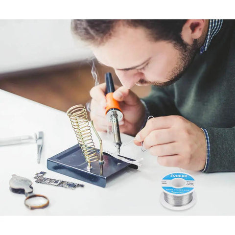 Man using soldering iron with 60/40 Tin Lead Solder Wire With Rosin Core For Easy, No Fuss Electrical Soldering, 1.0mm Diameter, 50g Spool
