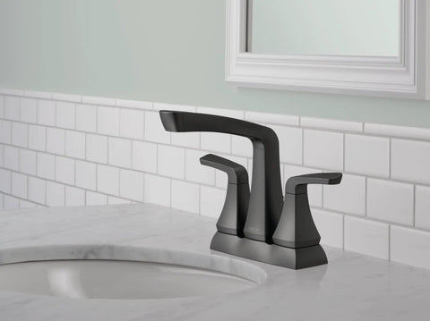 Vesna Matte Black 4 Inch Centerset Bathroom Faucet With Drain Assembly And Worry Free Drain Catch For 3 Hole Sinks installed on white sink