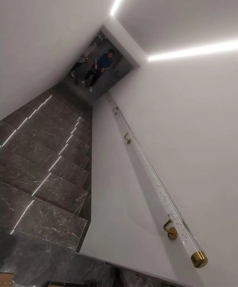 Rock Solid Super Clean Acrylic Stair Handrail With Gold Brackets And Hella Strong Non Slip Grip For Custom Wall Mount Indoor Or Outdoor Steps, side view installation on stairs.