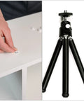 User installing Solid 160 Pack Waterproof Screw Cap Covers on a clean surface next to a black tripod, showcasing use and functionality.