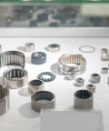 Various steel needle roller bearings displayed; includes 10 Pack HK1312 One Way Needle Roller Bearing 13x19x12mm Temperature Resistant Steel Clutch Bearing