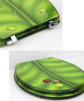 Heavy Duty Elongated Toilet Seat With Smooth Slow Close Lid And Rock Solid Metal Hinges Ergonomic Shape For Super Comfort Wear Resistant Coating Easy Install Fits Oval Toilets, green leaf design with ladybug.