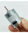 Beefy Little 380 DC Motor For DIY Projects 6V To 18V 12V 11000 RPM With 27.5mm Carbon Brush Impeller Design held in hand