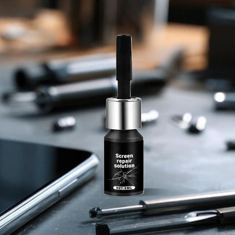 5ml Glass Repair Liquid Quick Fix Universal Fluid bottle on a table with phone and tools, for home use rapid scratch repair