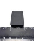 Rectangle Silicone Rubber Bumper Feet One And One Half Inch By One Inch Three Sixteenth Inch Thick with ruler for size reference