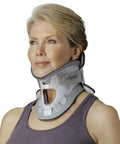 Woman wearing Cervical Collar Neck Brace For All Day Comfy And Solid Support Regular Size Easy On Off Adjustable Fit Lightweight Breathable Foam Pad