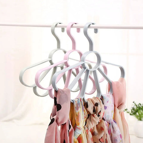 Fan Shaped Closet Rod Organizer For Ties Scarves And Hats Made From Sturdy Polypropylene, holding scarves on a rod.