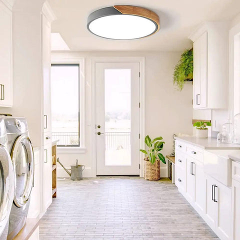 Sleek Modern Round Wood LED Ceiling Light 15.8 Inch Flush Mount Fixture in gray installed in bright laundry room