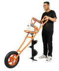 Beast 63cc 2 Stroke Gas Auger Post Hole Digger With 11.81 Inch Bit, orange with single wheel, held by person