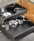 Knockout Heavy Duty Pull Out Cabinet Organizer With Dang Easy Setup And Tough Nano Adhesive For Smooth Glide Pot And Pan Storage located in a kitchen cabinet.
