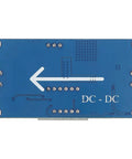 Back view of Adjustable DC-DC Buck Converter Power Module With Digital Voltmeter Display, showing blue circuit board design.
