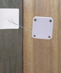 Automatic Sliding Door Closer With Soft Self Closing, Easy Install Kit shown on wooden door using a wire connection system