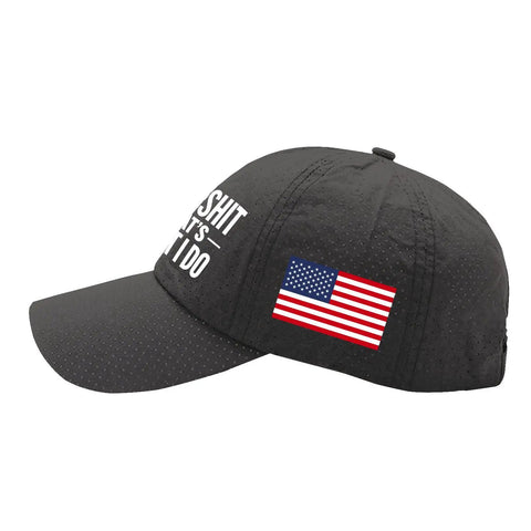 Side view of a black baseball cap with an American flag emblem and white text, made of breathable fabric for outdoor use.