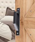 Close-up of 7.9 Inch Sliding Barn Door Handle Black 2 Pack Wooden Door Pull Handle for barn doors in farmhouse setting.