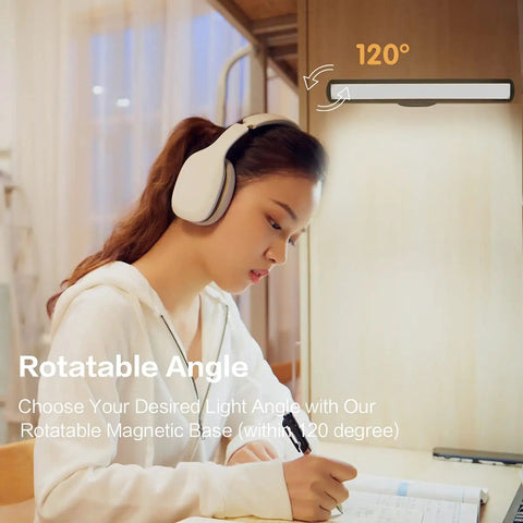 Woman studying under Cordless Battery Powered LED Magnetic Strip Light With Remote Control 5W Desk Lamp, 120° angle adjustment.