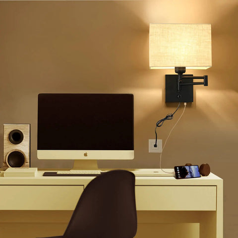 Cozy 9.5 Inch Wall Lamp With USB Port Dimmer Swing Arm Plug In Cord Beige Fabric Shade Ideal For Bedroom Living Room Office Hallway Warm Glow And Modern Convenience installed above a desk with computer