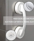 JanTeelGO Portable Suction Grab Bar With Strong Hold on a smooth surface, showcasing white ABS plastic and a strong suction cup.