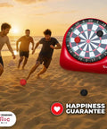 People playing on a beach with Inflatable Giant Kick Darts Set With Jumbo Soccer Dartboard And Air Pump For Backyard Carnival Games And Outdoor Fun Perfect For Kids And Adults 15 Plus Ways To Play