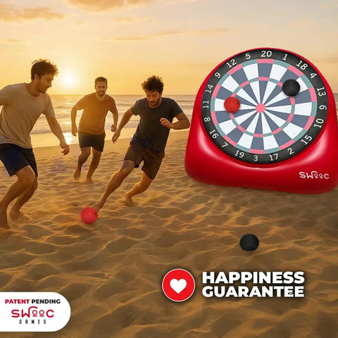 People playing on a beach with Inflatable Giant Kick Darts Set With Jumbo Soccer Dartboard And Air Pump For Backyard Carnival Games And Outdoor Fun Perfect For Kids And Adults 15 Plus Ways To Play