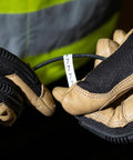 Wire Marker Book For Cable Management And Electric Panel Organization With Numbered 1 To 48 Labels, gloves holding a cable