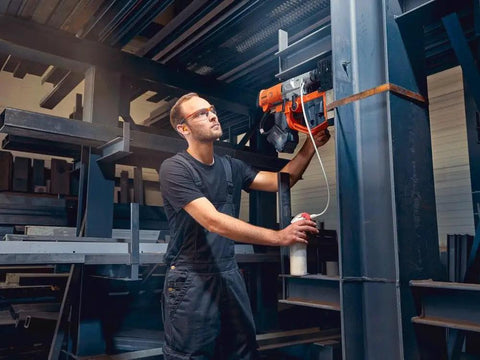 Heavy Hitter Portable Magnetic Base Drill Machine With Brushless Motor 18V Cordless Power Tool in use on steel structure.