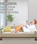 Woman on couch using 3 Inch Brown Rubber Caster Cups That Grip Like Crazy For Beds Couches Desks And Tables Non Slip Furniture Pads