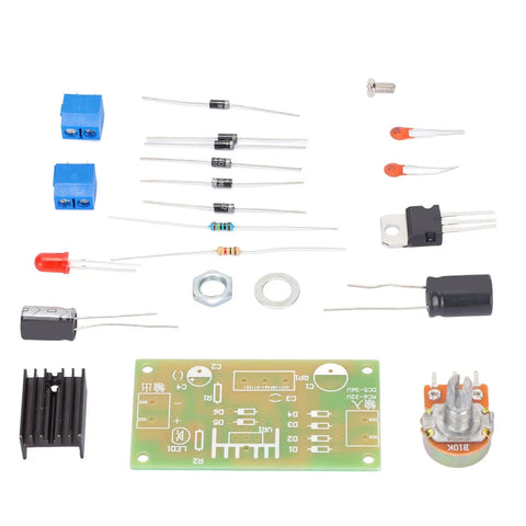 Components for Built Tough LM317 Adjustable Regulated Power Supply Kit including resistors, capacitors, and circuit board.