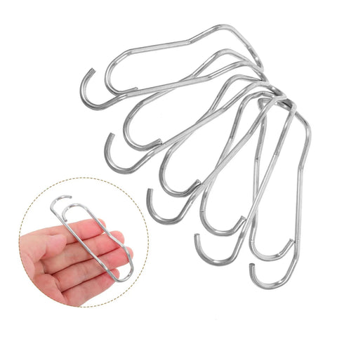 Plant Trellis Buckles 50 Pack For Garden Fences And Climbing Plants Quick Install And Easy Removal Clips shown in hand.
