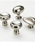 Assorted polished chrome zinc alloy drawer pulls on white background, including Titanium Silver Round Dome Cabinet Knobs 1.07 Inch.
