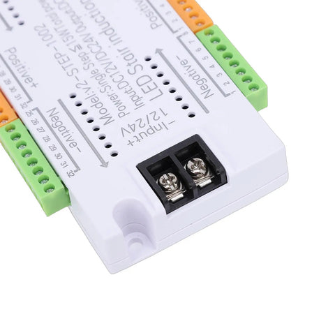 Motion Sensor LED Stair Light Controller with 32 channel sequential activation and adjustable speed close-up of terminal details.