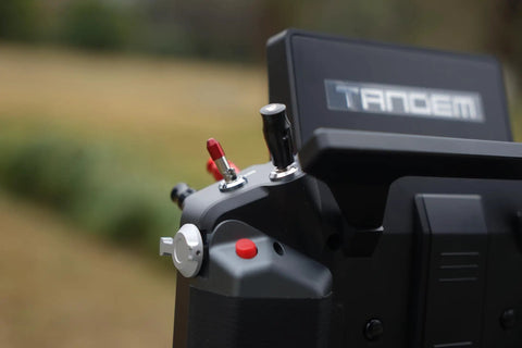 Close-up of Tandem X20 Pro AW Radio Transmitter Battleship Grey Ultimate Combo showing control switches and side details.