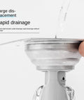 Odor Stopper for Shower - Anti-Odor Mini Bottle Trap Design showing rapid drainage feature with water flow in stainless steel.